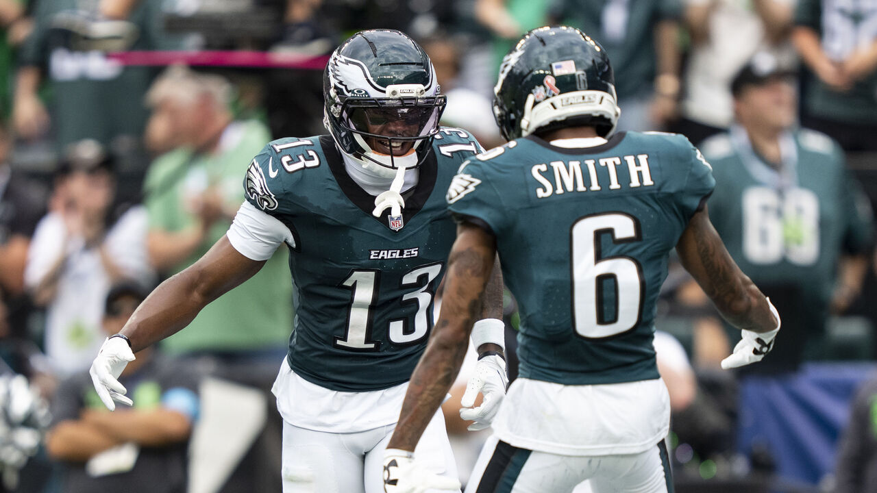PHILADELPHIA, PENNSYLVANIA - SEPTEMBER 13: Dontayvion Wicks #13 celebrates with his teammate DeVonta Smith #6 of the Philadelphia Eagles after scoring a touchdown against the Washington Commanders during an NFL football game at Lincoln Financial Field on September 13, 2026 in Philadelphia, Pennsylvania.