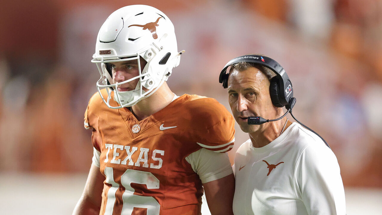 AUSTIN, TEXAS - SEPTEMBER 12: Head coach Steve Sarkisian of the Texas Longhorns speaks with Arch Manning #16 of the Texas Longhorns during the fourth quarter against the Ohio State Buckeyes at Darrell K Royal-Texas Memorial Stadium on September 12, 2026 in Austin, Texas.