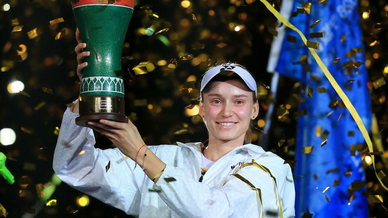 Kazakhstan's Elena Rybakina celebrates with trophy after winning against Canada's Leylah Fernandez during their women's singles final match at the Ningbo Open tennis tournament in Ningbo, China's eastern Zhejiang province on October 25, 2026. / China OUT