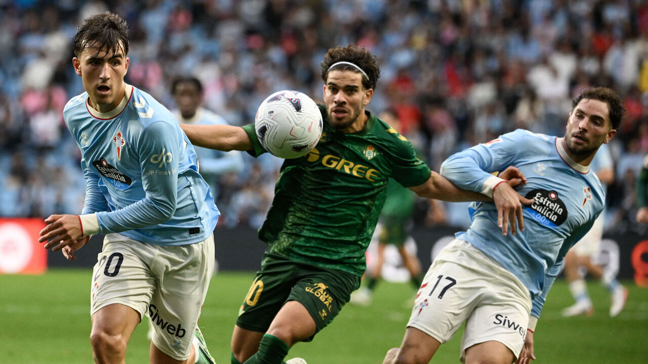 (L-R) Celta Vigo's Spanish defender #20 Javier Rodriguez, Real Betis' Moroccan forward #10 Abde Ezzalzouli, and Celta Vigo's Spanish defender #17 Javi Rueda vie for the ball during the Spanish league football match between RC Celta de Vigo and Real Betis at Balaidos Stadium in Vigo on October 25, 2026.