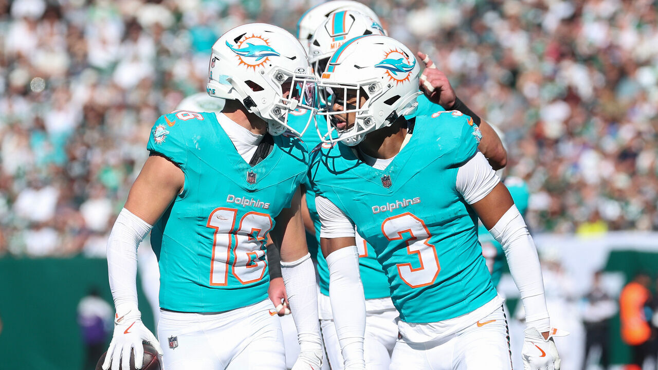 EAST RUTHERFORD, NEW JERSEY - OCTOBER 25: Michael Taaffe #16 of the Miami Dolphins and Chris Johnson #3 of the Miami Dolphins celebrate his second quarter interception against the New York Jets at MetLife Stadium on October 25, 2026 in East Rutherford, New Jersey.