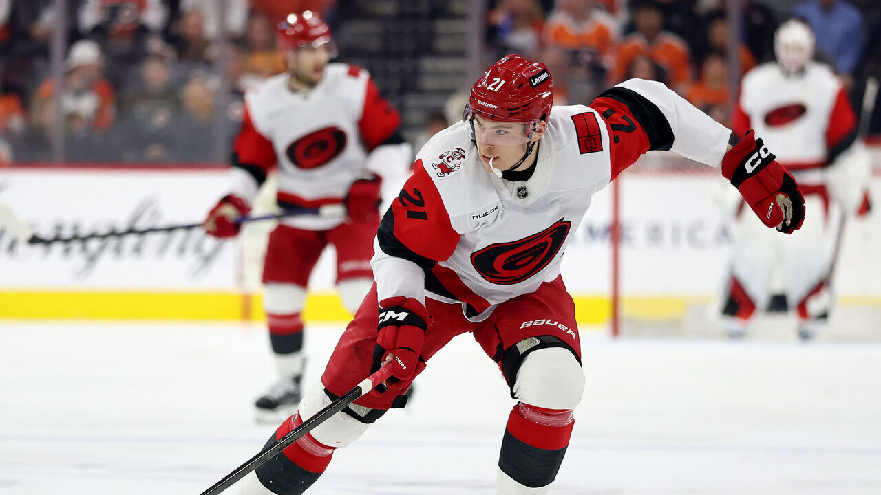 PHILADELPHIA, PENNSYLVANIA - APRIL 13: Alexander Nikishin #21 of the Carolina Hurricanes controls the puck during the first period against the Philadelphia Flyers at Xfinity Mobile Arena on April 13, 2026 in Philadelphia, Pennsylvania.