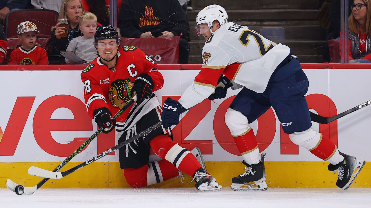 CHICAGO, IL - OCTOBER 25: Connor Bedard #98 of the Chicago Blackhawks controls the puck against Lars Eller #20 of the Florida Panthers during first period on October 25, 2026 at the United Center in Chicago.
