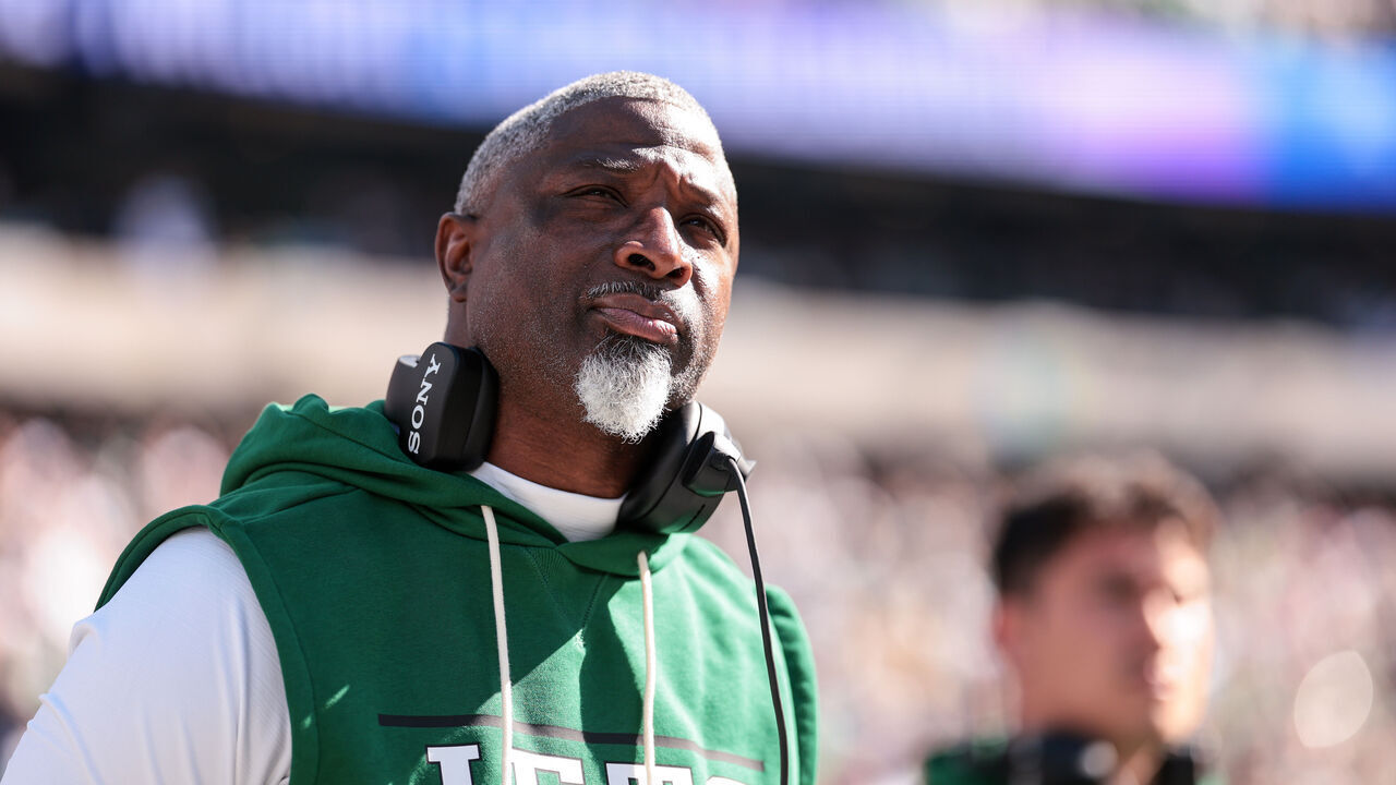EAST RUTHERFORD, NEW JERSEY - OCTOBER 25: Head Coach Aaron Glenn of the New York Jets stands on the sideline during the national anthem prior to the game against the Miami Dolphins at MetLife Stadium on October 25, 2026 in East Rutherford, New Jersey.