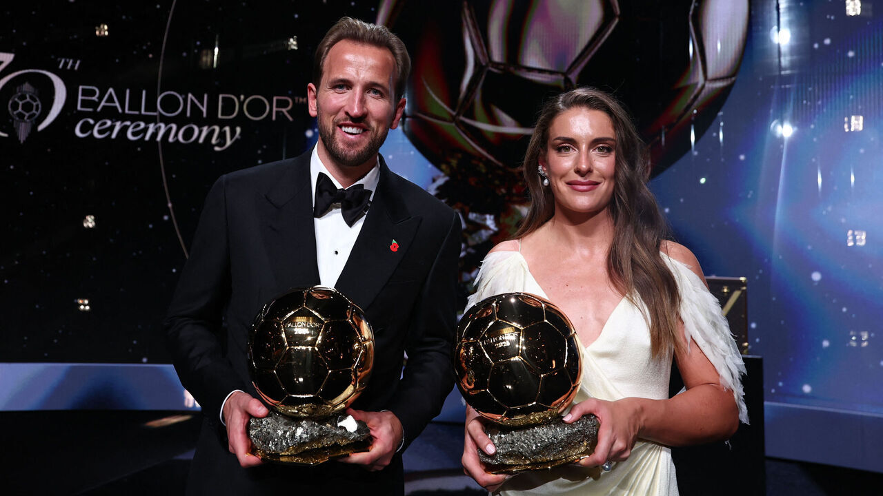 Spain and Barcelona midfielder Alexia Putellas and England and Bayern Munich forward Harry Kane pose with their trophies on stage after receiving their Ballon d'Or awards for the best female and male footballer during the 2026 Ballon d'Or France Football award ceremony at the Palladium Theatre in London on October 26, 2026.