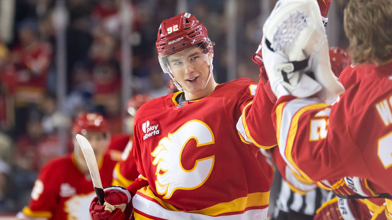 CALGARY, CANADA - OCTOBER 26: Matvei Gridin #92 of the Calgary Flames celebrates with teammates after scoring a goal against the Toronto Maple Leafs during the first period at the Scotiabank Saddledome on October 26, 2026 in Calgary, Canada.