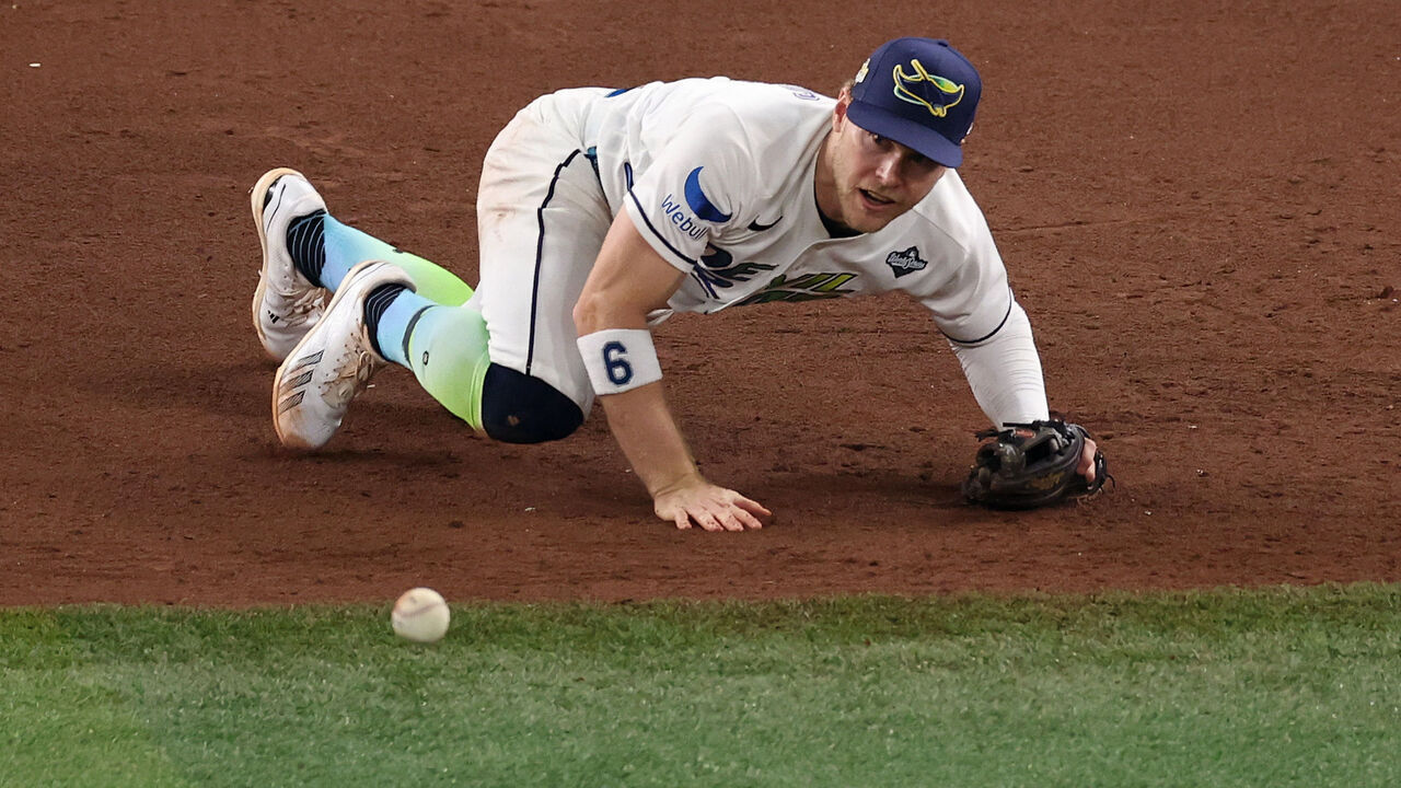 ST PETERSBURG, FLORIDA - OCTOBER 26: Taylor Walls #6 of the Tampa Bay Rays attempts to field a ball during the fifth inning against the Milwaukee Brewers in game three of the 2026 World Series at Tropicana Field on October 26, 2026 in St Petersburg, Florida.