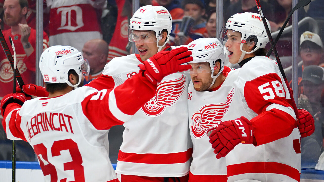 EDMONTON, CANADA - OCTOBER 26: Alex DeBrincat #93, Andreas Englund #24, Viktor Arvidsson #33 and Emmitt Finnie #58 of the Detroit Red Wings celebrate a third-period goal against the Edmonton Oilers during the game at Rogers Place on October 26, 2026, in Edmonton, Alberta, Canada.