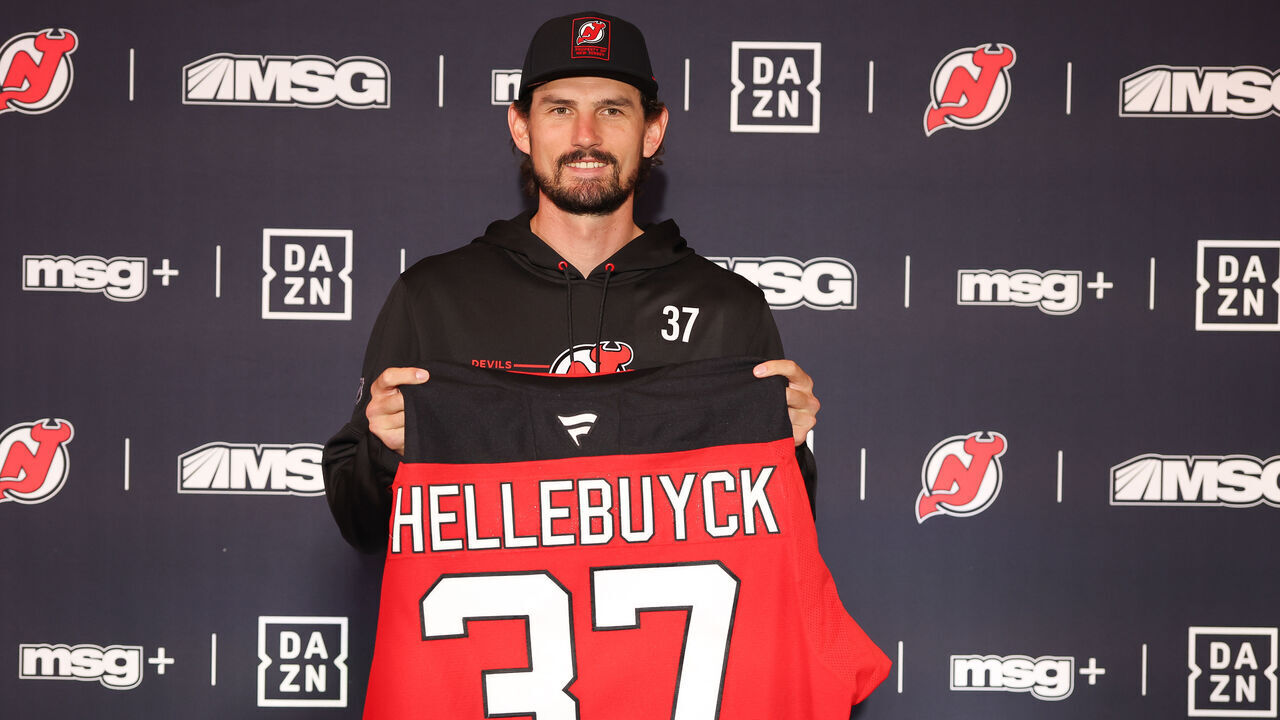NEWARK, NEW JERSEY - OCTOBER 24: Connor Hellebuyck poses for a photo for the media after being traded to the New Jersey Devils from the Winnipeg Jets at Prudential Center on October 24, 2026 in Newark, New Jersey.