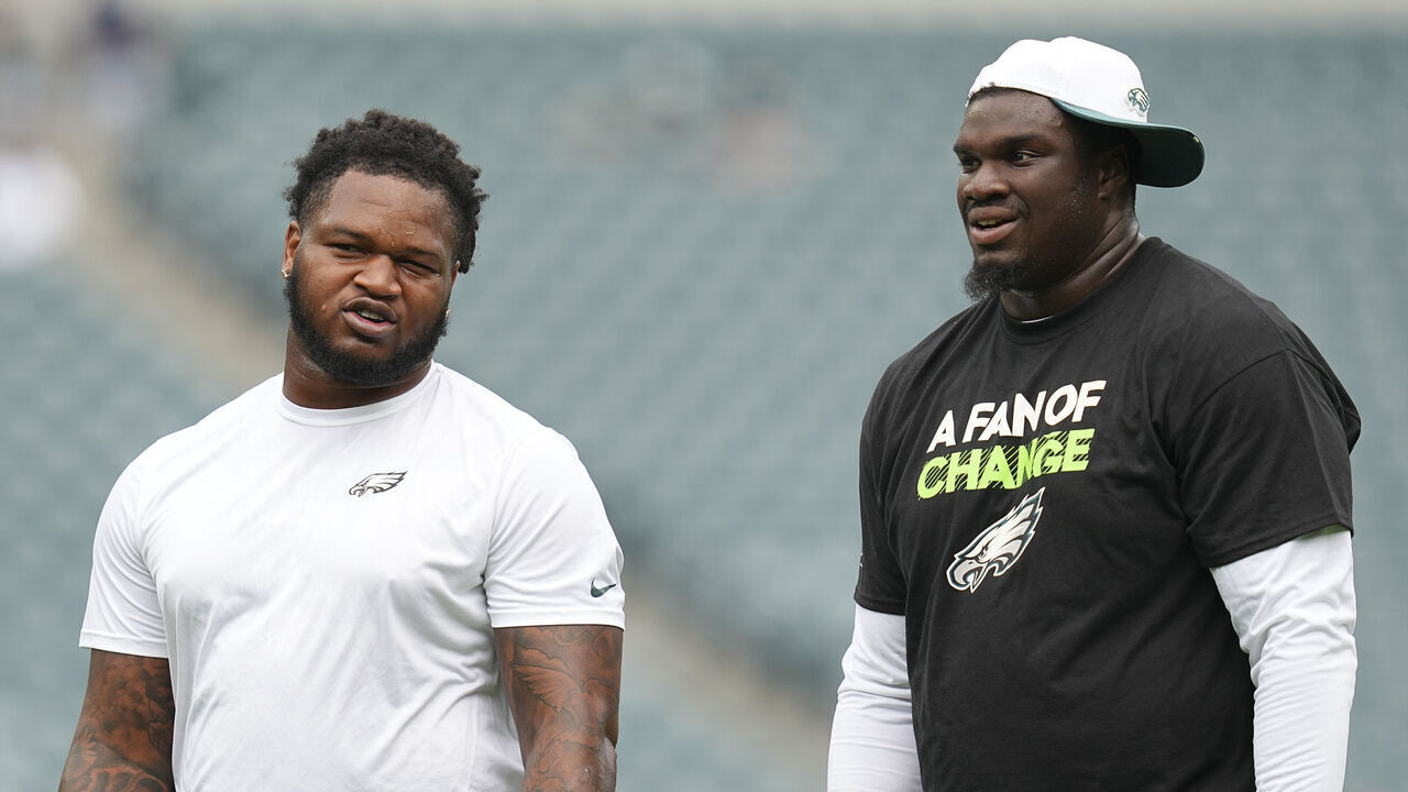 PHILADELPHIA, PENNSYLVANIA - AUGUST 16: Jalen Carter #98 and Jordan Davis #90 of the Philadelphia Eagles look on against the Cleveland Browns during the NFL Preseason 2025 game at Lincoln Financial Field on August 16, 2025 in Philadelphia, Pennsylvania. The Cleveland Browns defeated the Philadelphia Eagles 22-13.