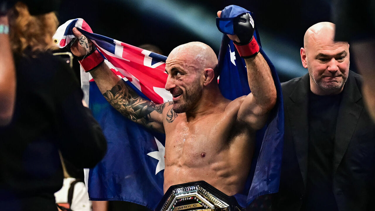 Australia's Alexander Volkanovski (C) celebrates after defeating Russia's Movsar Evloev in their men's featherweight fight during the UFC Fight Night event at Etihad Arena in Abu Dhabi early on October 25, 2026.