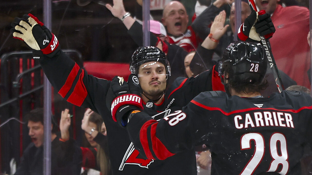 RALEIGH, NORTH CAROLINA - OCTOBER 27: Sebastian Aho #20 of the Carolina Hurricanes reacts with teammate William Carrier #28 after scoring a goal during the third period of the game against the Boston Bruins at Lenovo Center on October 27, 2026 in Raleigh, North Carolina.