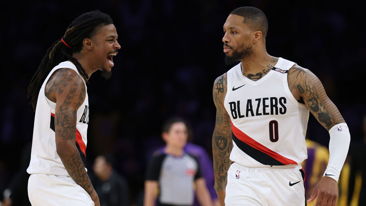 LOS ANGELES, CALIFORNIA - OCTOBER 27: Ja Morant #1 and Damian Lillard #0 of the Portland Trail Blazers celebrate a Lillard three pointer during a 136-129 Blazers win over the Los Angeles Lakers at Crypto.com Arena on October 27, 2026 in Los Angeles, California.
