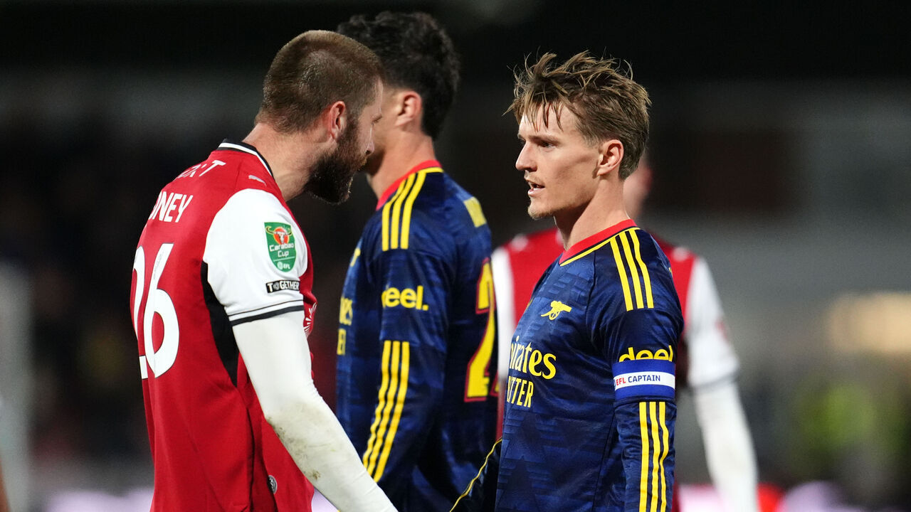 Tempers fray between Fleetwood Town's Shaun Rooney and Arsenal's Martin Odegaard during the Carabao Cup, fourth round match at Highbury Stadium, Fleetwood. Picture date: Tuesday October 27, 2026.