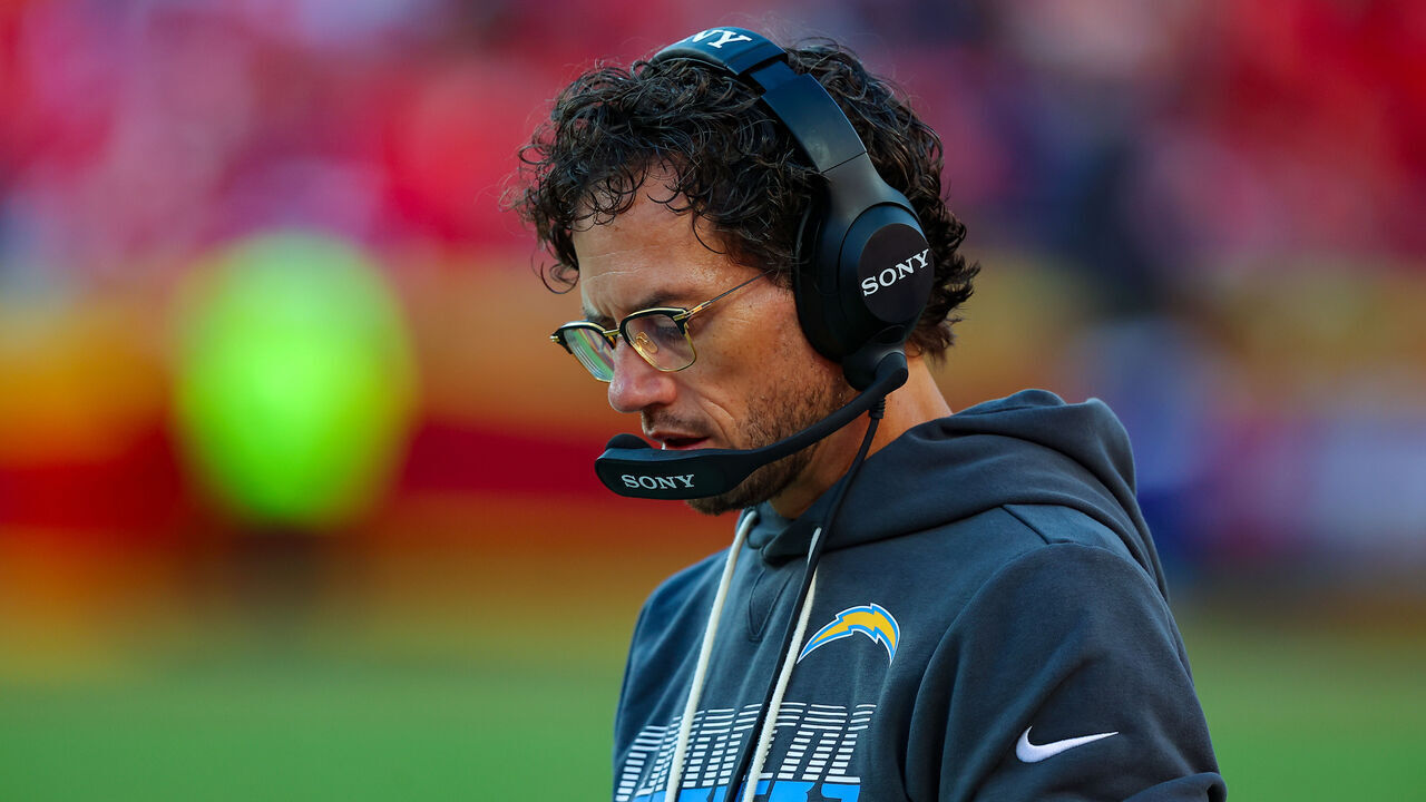 KANSAS CITY, MISSOURI - OCTOBER 18: Mike McDaniel, offensive coordinator with the Los Angeles Chargers, looks at his play sheet during the game against the Kansas City Chiefs at Arrowhead Stadium on October 18, 2026 in Kansas City, Missouri.
