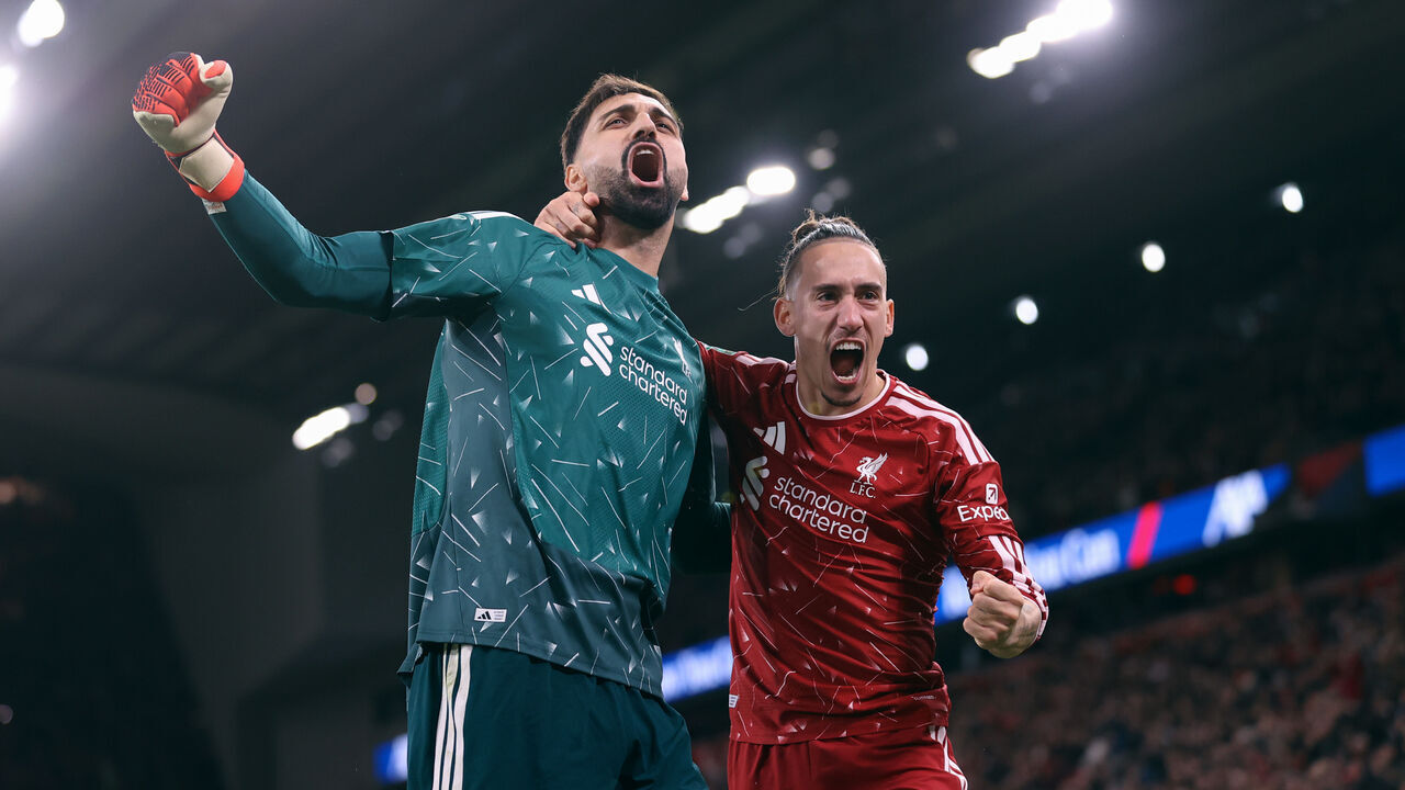 LIVERPOOL, ENGLAND - OCTOBER 28: Liverpool goalkeeper Giorgi Mamardashvili celebrates victory with Kostas Tsimikas of Liverpool during the Carabao Cup Fourth Round match between Liverpool and Chelsea at Anfield on October 28, 2026 in Liverpool, England.