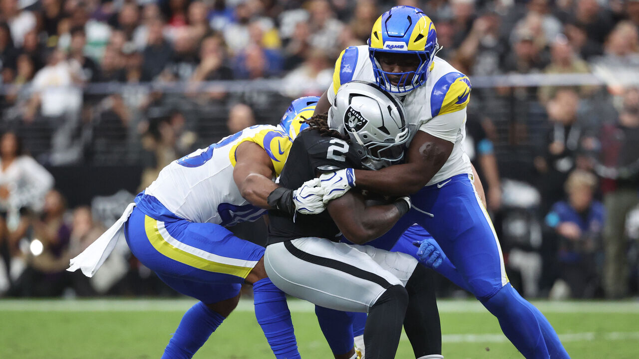 LAS VEGAS, NEVADA - OCTOBER 25: Ashton Jeanty #2 of the Las Vegas Raiders is tackled by Byron Young #0 of the Los Angeles Rams during the second quarter at Allegiant Stadium on October 25, 2026 in Las Vegas, Nevada.