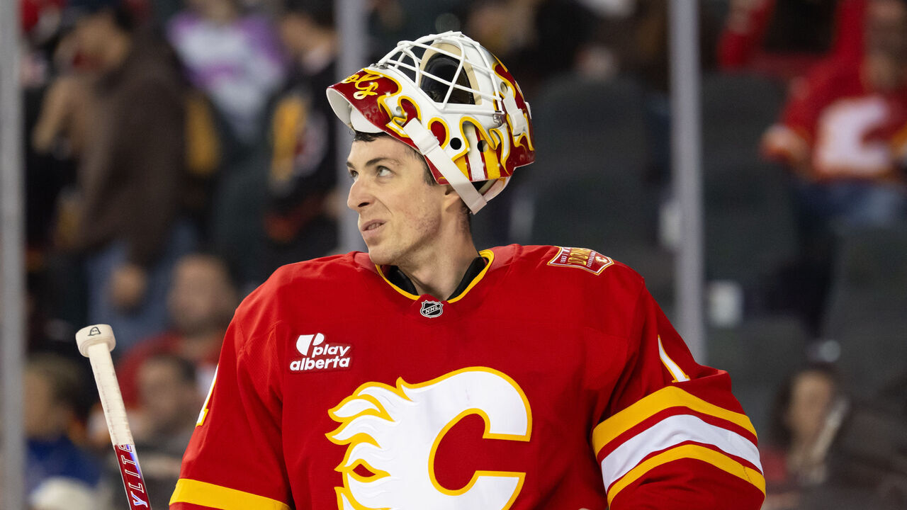 CALGARY, CANADA - OCTOBER 22: Devin Cooley #1 of the Calgary Flames looks on between whistles during the second period of a game against the Minnesota Wild at the Scotiabank Saddledome on October 22, 2026 in Calgary, Canada.