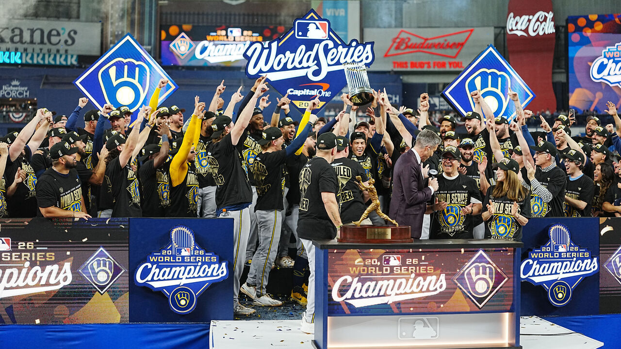 ST. PETERSBURG, FL - OCTOBER 28: Members of the Milwaukee Brewers celebrate as Christian Yelich #22 lifts The Commissioner's Trophy after Game Five of the 2026 World Series presented by Capital One between the Milwaukee Brewers and the Tampa Bay Rays at Tropicana Field on Wednesday, October 28, 2026 in St. Petersburg, Florida.