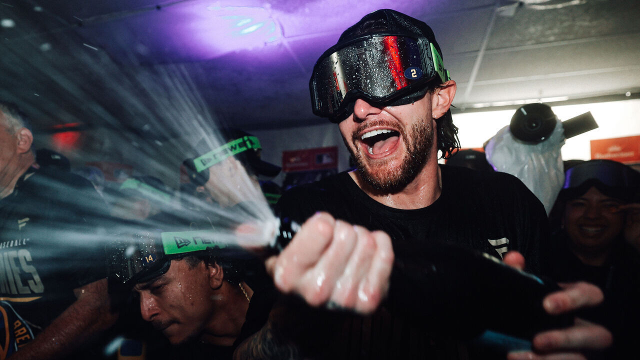 ST PETERSBURG, FLORIDA - OCTOBER 28: Brice Turang #2 of the Milwaukee Brewers celebrates in the locker room with teammates after defeating the Tampa Bay Rays in the 2026 World Series at Tropicana Field on October 28, 2026 in St Petersburg, Florida.