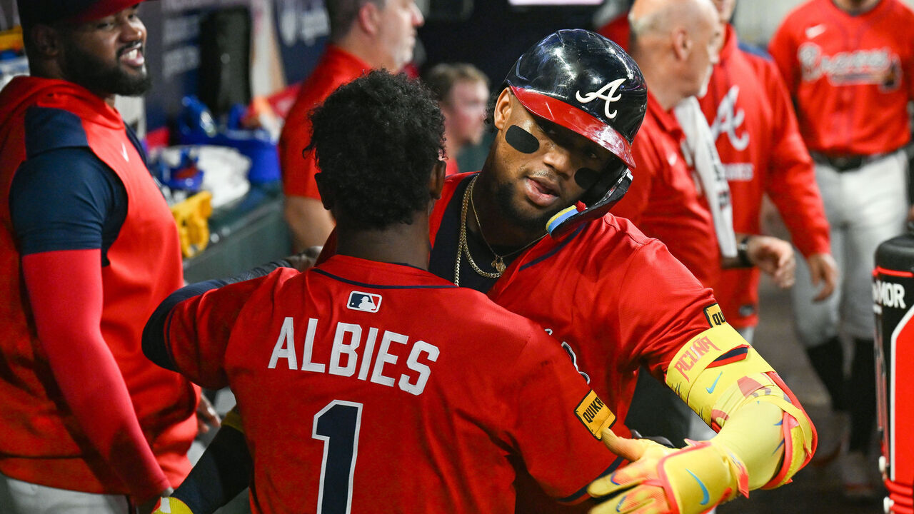 ATLANTA, GA AUGUST 22: Atlanta right fielder Ronald Acuna Jr. (13) is embraced by teammate Ozzie Albies (1) after hitting his 15th home run during the MLB game between the New York Mets and the Atlanta Braves on August 22nd, 2025 at Truist Park in Atlanta, GA.