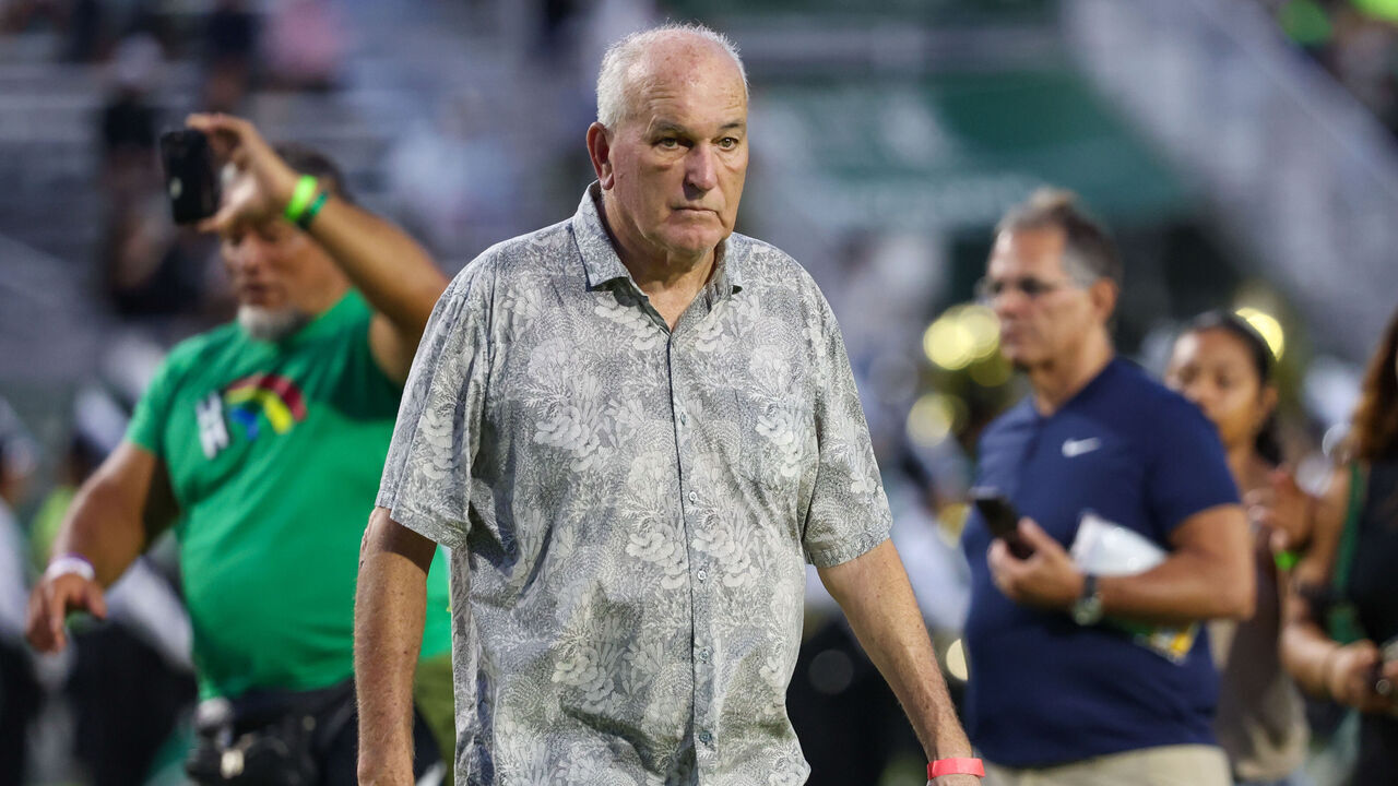 HONOLULU, HAWAII - OCTOBER 26: June Jones walks onto the field before the game against the Nevada Wolfpack at the Clarence T.C. Ching Athletics Complex on October 26, 2024 in Honolulu, Hawaii.