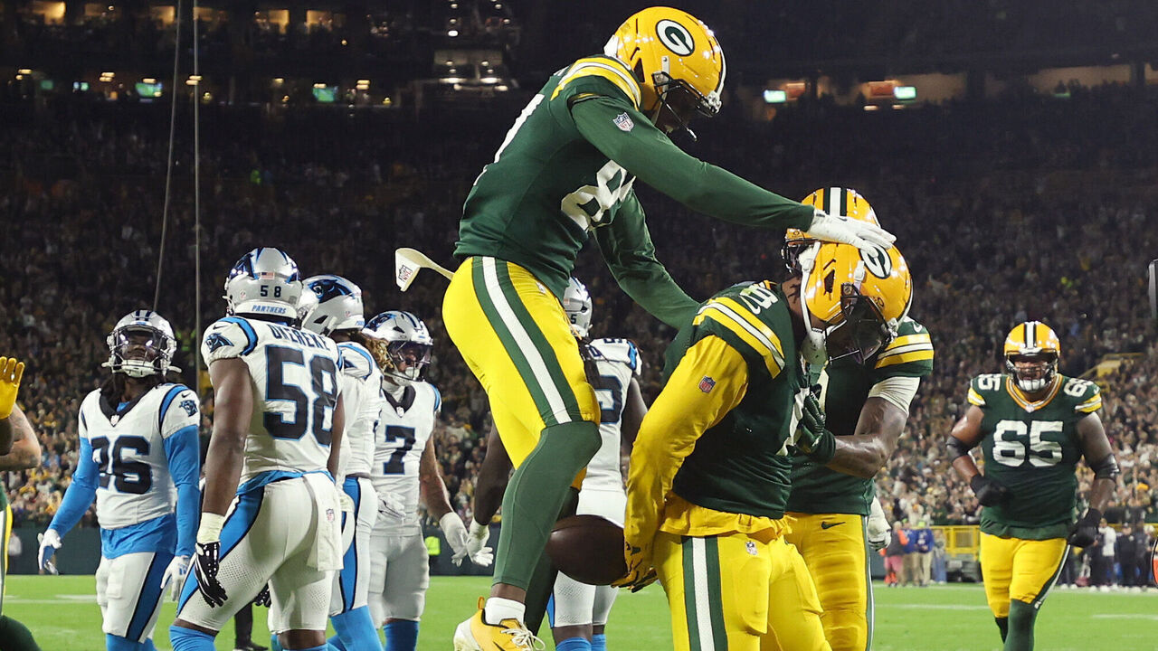 GREEN BAY, WISCONSIN - OCTOBER 29: Josh Jacobs #8 of the Green Bay Packers celebrates a touchdown with J. Michael Sturdivant #87 of the Green Bay Packers during the second quarter against the Carolina Panthers at Lambeau Field on October 29, 2026 in Green Bay, Wisconsin.
