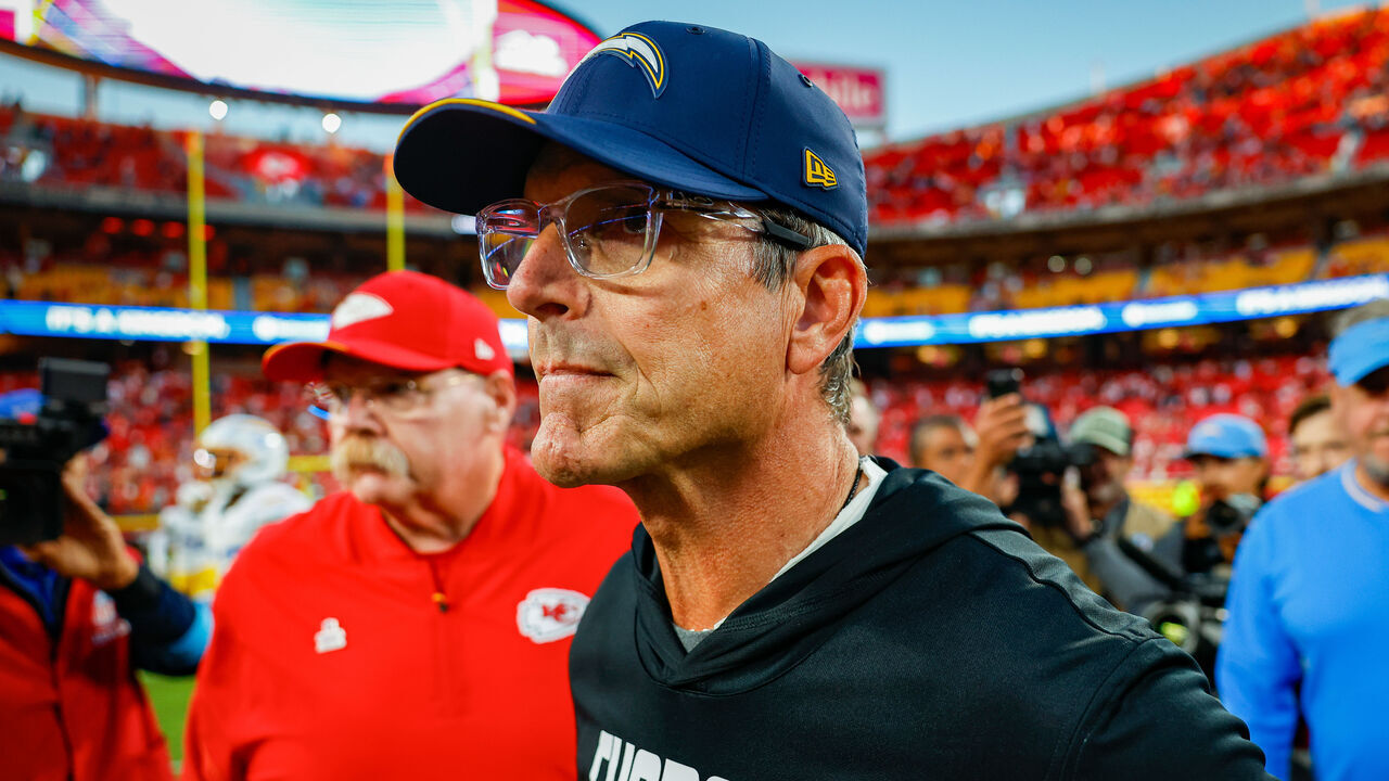 KANSAS CITY, MISSOURI - OCTOBER 18: Head coach Jim Harbaugh of the Los Angeles Chargers greets head coach Andy Reid of the Kansas City Chiefs at Arrowhead Stadium on October 18, 2026 in Kansas City, Missouri.