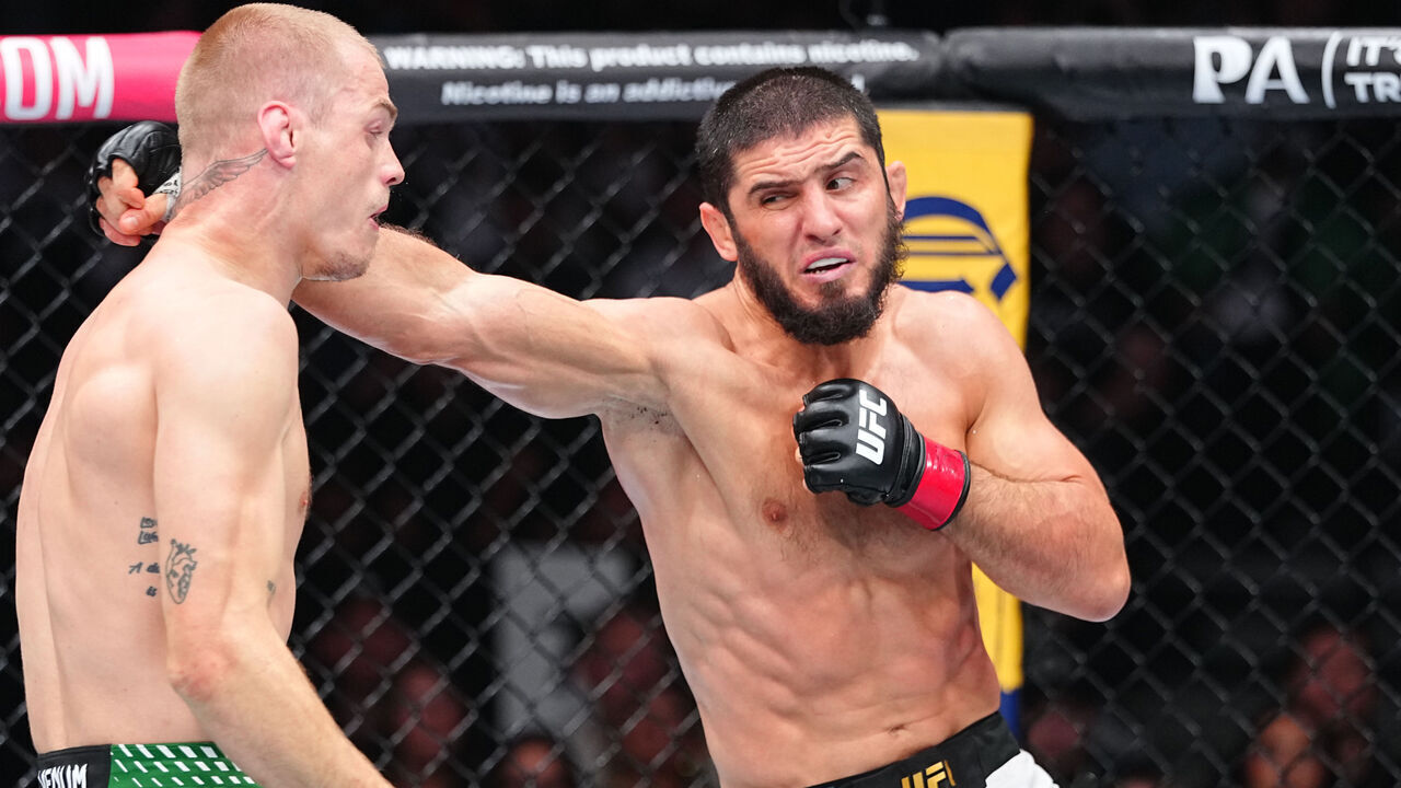 PHILADELPHIA, PENNSYLVANIA - AUGUST 15: (R-L) Islam Makhachev of Russia punches Ian Machado Garry of Ireland in the UFC welterweight championship fight during the UFC 330 event at Xfinity Mobile Arena on August 15, 2026 in Philadelphia, Pennsylvania.