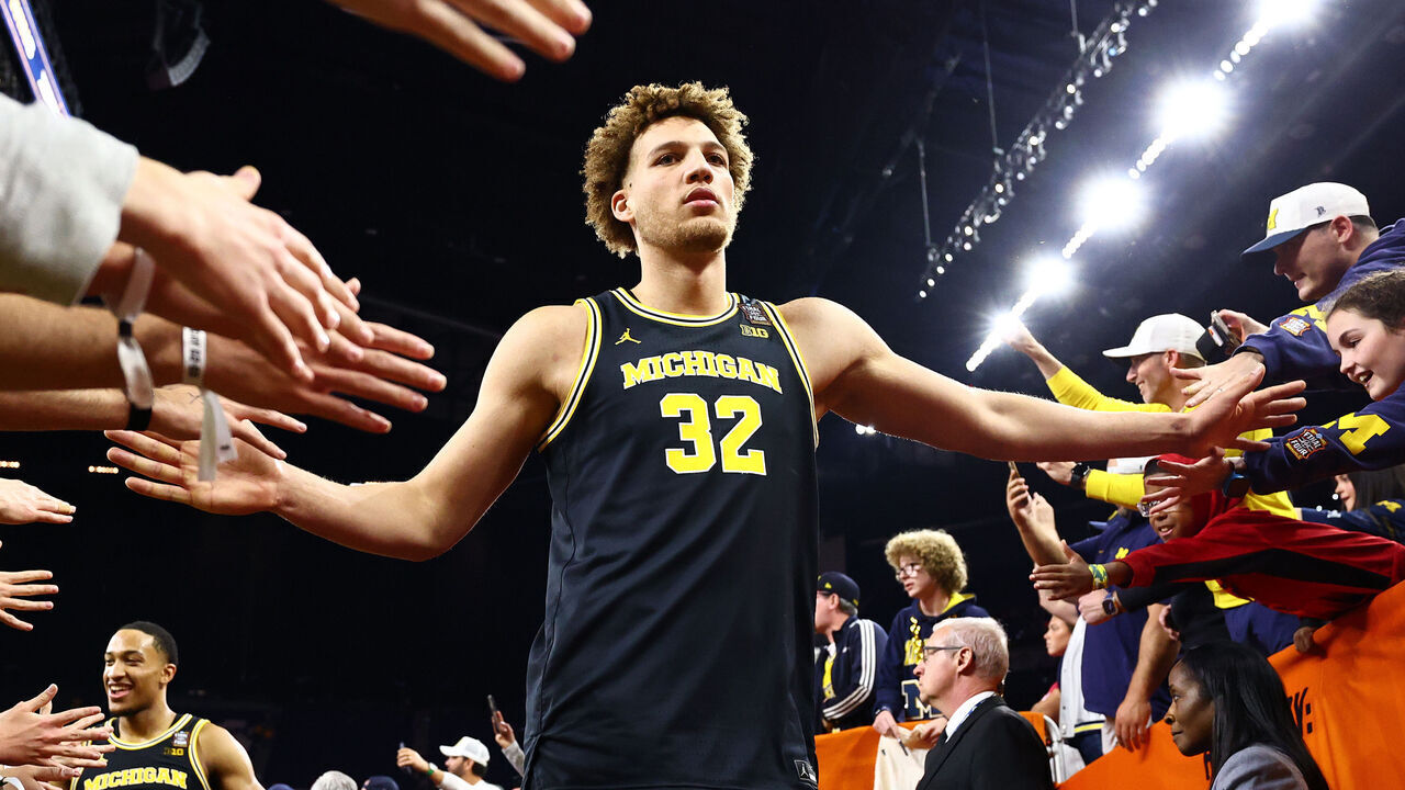 INDIANAPOLIS, INDIANA - APRIL 04: Malick Kordel #32 of the Michigan Wolverines celebrates with fans after defeating the Arizona Wildcats in the Final Four of the 2026 NCAA Men's Basketball Tournament at Lucas Oil Stadium on April 04, 2026 in Indianapolis, Indiana.