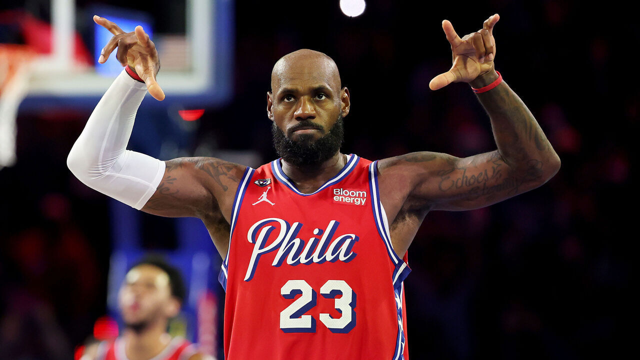 PHILADELPHIA, PENNSYLVANIA - OCTOBER 30: LeBron James #23 of the Philadelphia 76ers celebrates a three-pointer by Vj Edgecombe #77 (not pictured) during the second half of an Emirates NBA Cup game against the New York Knicks at Xfinity Mobile Arena on October 30, 2026 in Philadelphia, Pennsylvania.