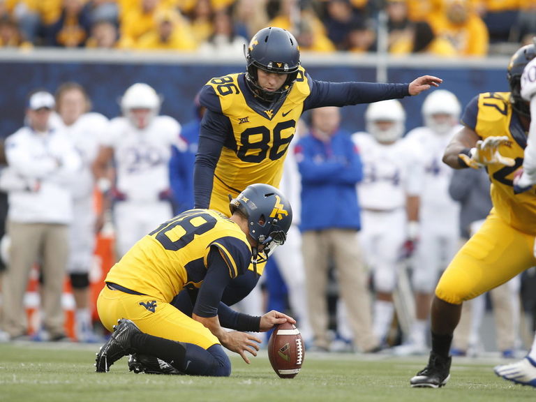 VIDEO West Virginia kicker gets hit below the belt