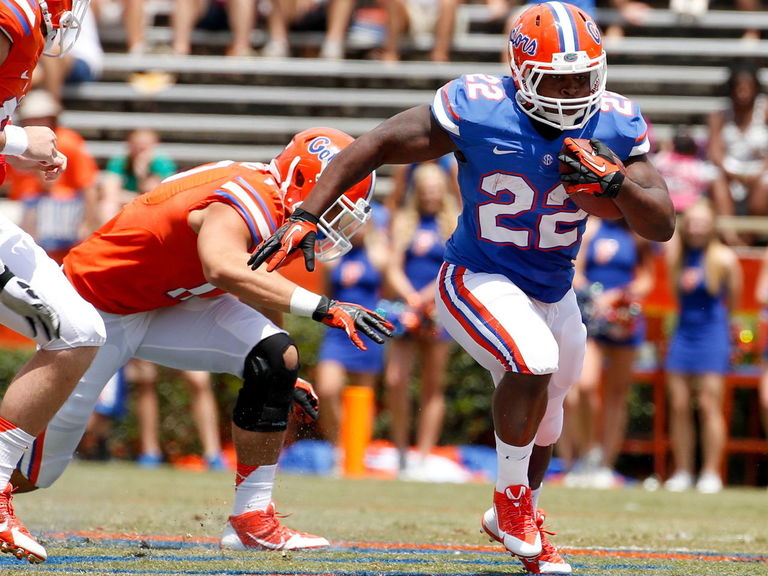 Florida's Adam Lane embraces soiling pants during Birmingham Bowl ...