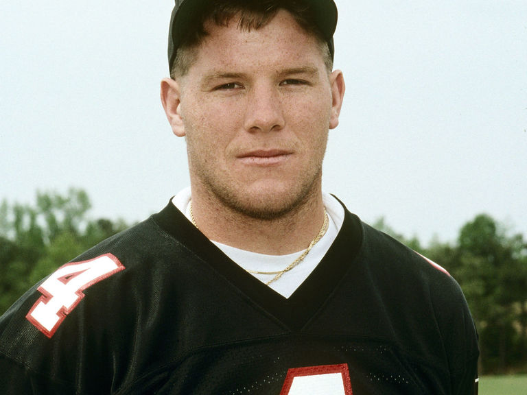 Brett Favre walks the sideline as a member of the Atlanta Falcons