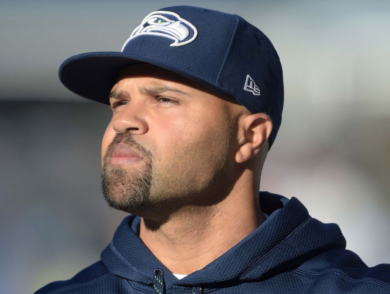 Seahawks defensive coodinator Kris Richard makes a tough phone